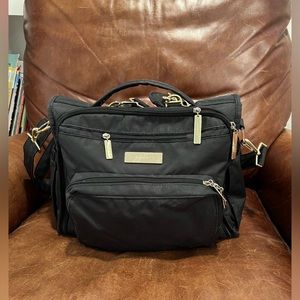 Jujube diaper bag. Black with gold accents.